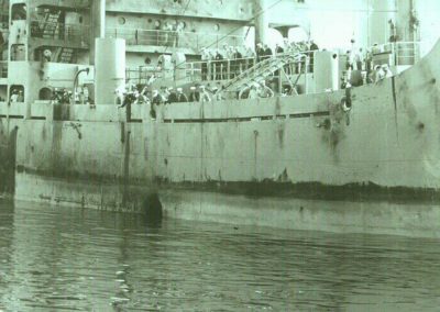 starboard side of USS Liberty, part of torpedo hole is visible above the water line